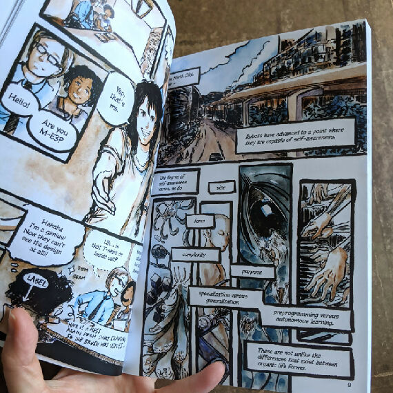 Now Recharging Book 1 opened to a spread showing ink and watercolour comic art of an android  being interviewed, followed by intro shots of a city and a world of diverse robots.