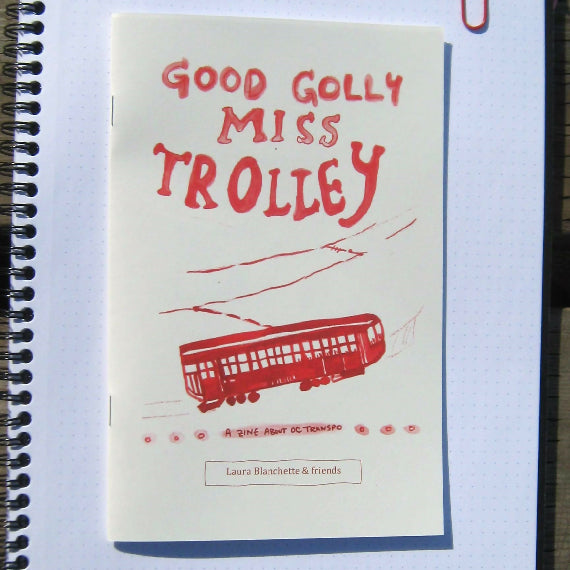 Cover of the zine reads "Good Golly Miss Trolley; A zine about OC Transpo." Below the title is a painting of a red trolley.